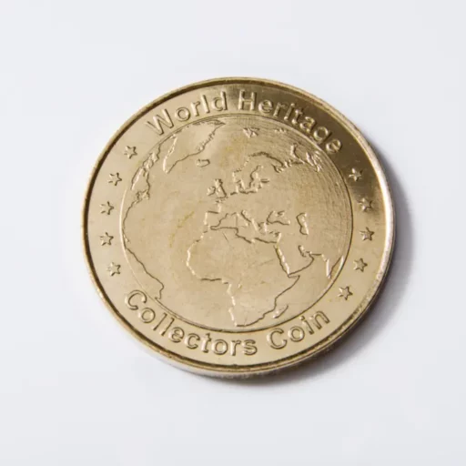 World Heritage collector's coin from National Tokens for UNESCO heritage sites. On the coin is a blind map of the planet.